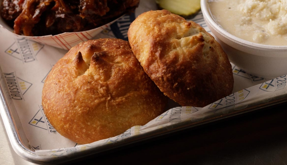 Crossbuck BBQ's fresh baked bread on a tray with pulled pork