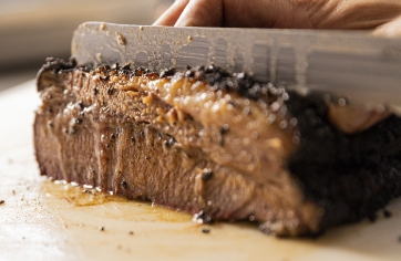 Crossbuck BBQ's Central Texas Style Smoked Brisket being sliced
