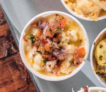 Crossbuck BBQ's Fresh Hominy with Epazote, Herbs, Heavy Cream and cotija cheese.