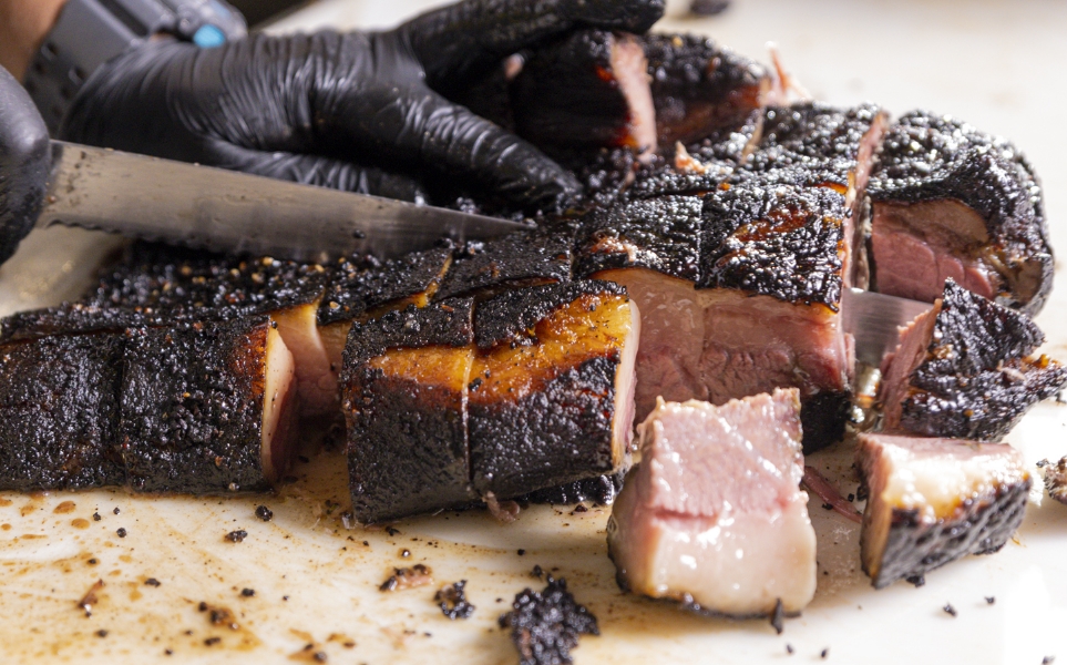 burnt ends being cubed from point of brisket