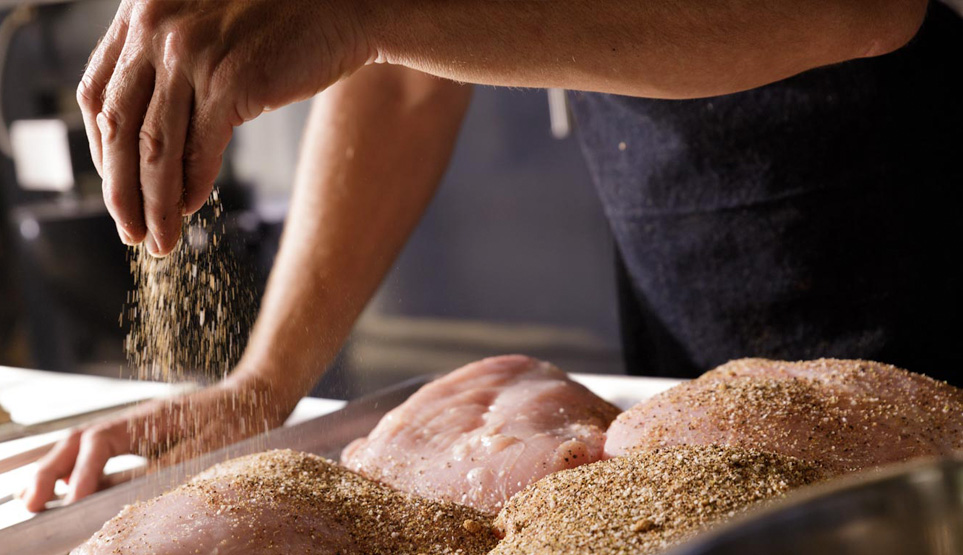 Crossbuck BBQ's smoked turkey being seasoned prior to smoking