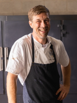 Chef Tim McLaughlin laughing in the kitchen